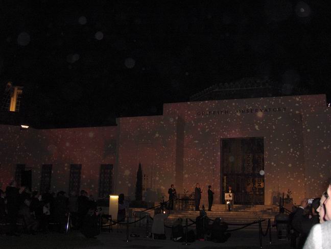 Dr. Ed Krupp, Griffith Observatory director, basks in the light of the Milky Way stars splayed across the observatorys front walls